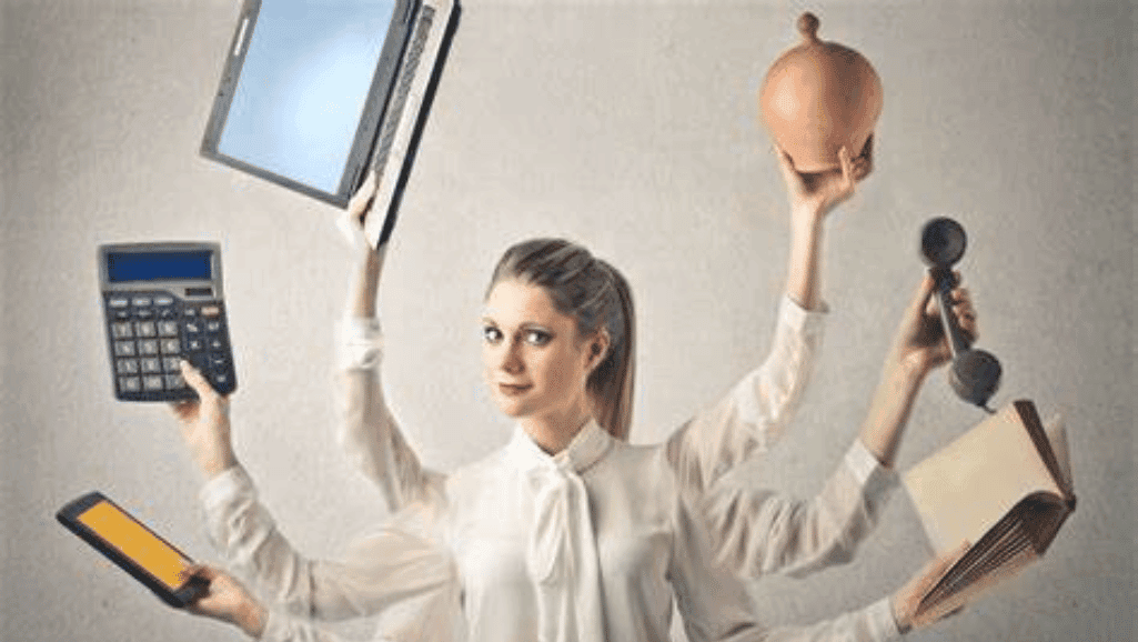 a woman holding a laptop and a pot of coffee